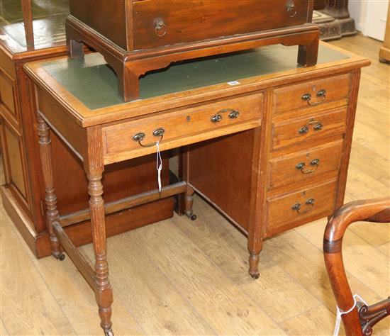 An oak leather top students desk, W.99cm